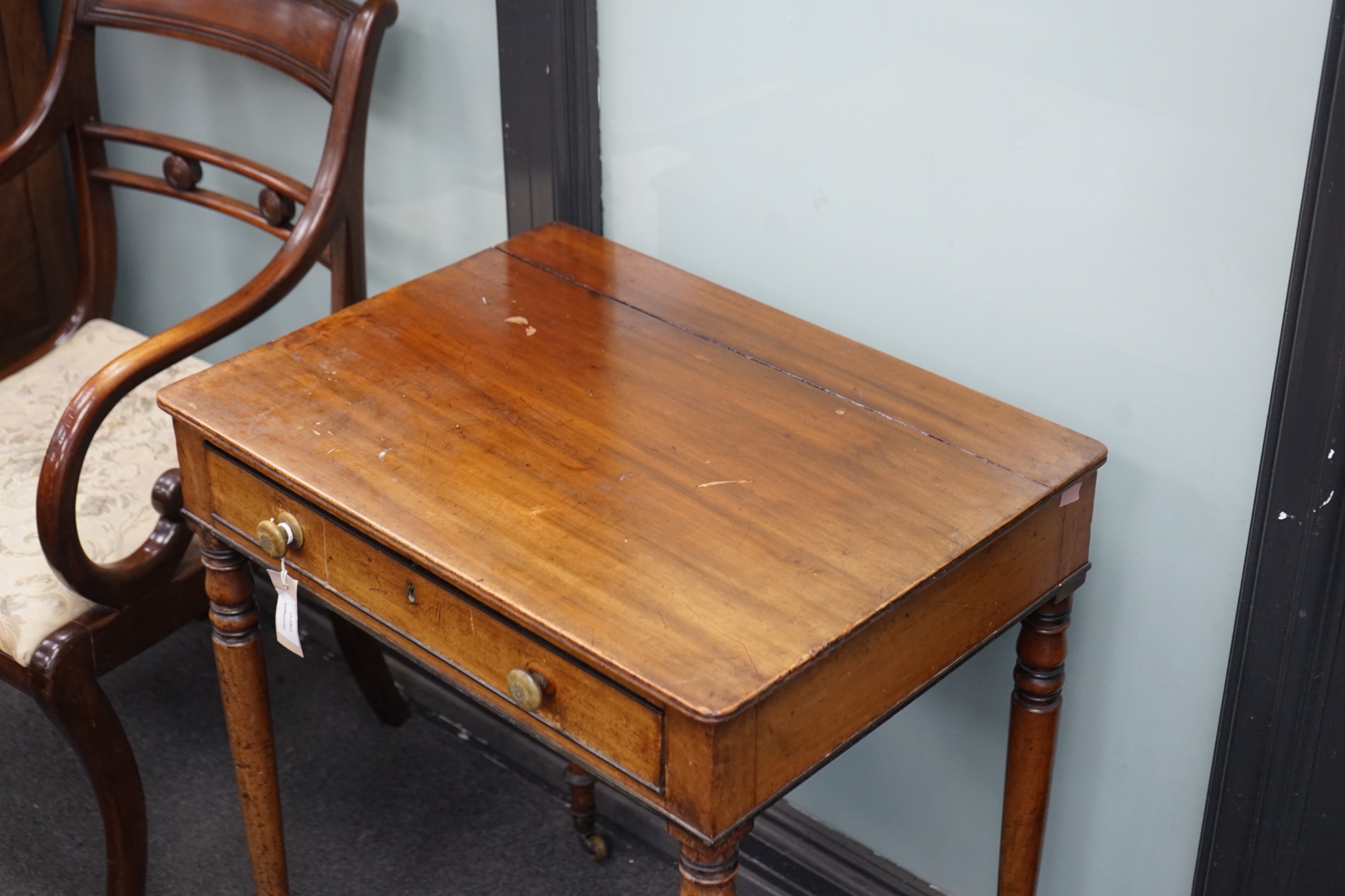 A George IV mahogany writing table with frieze drawer on turned legs, width 61cm, depth 45cm, height 73cm